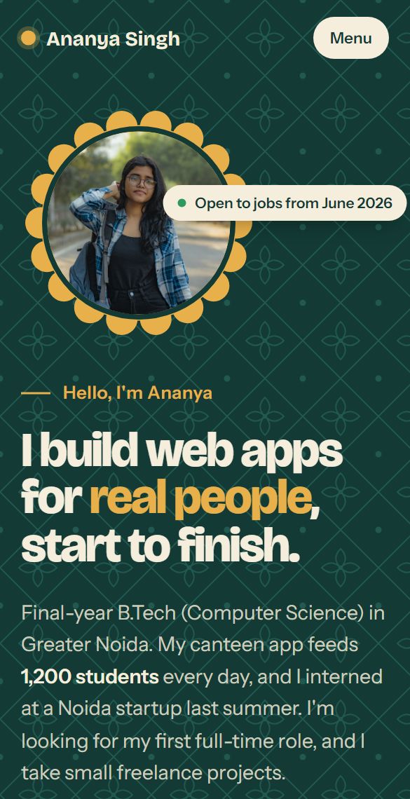 Ananya's site in forest green with her photo in a scalloped frame, on a phone